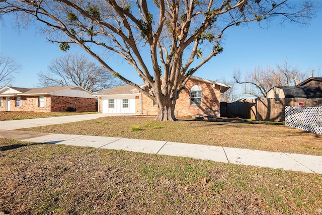 ranch-style house with a front yard