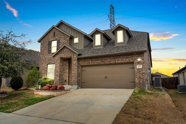 front facade with a garage and central air condition unit