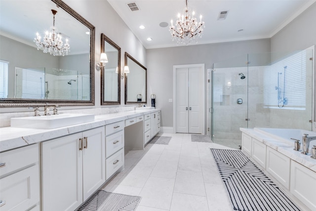 bathroom with crown molding and a chandelier