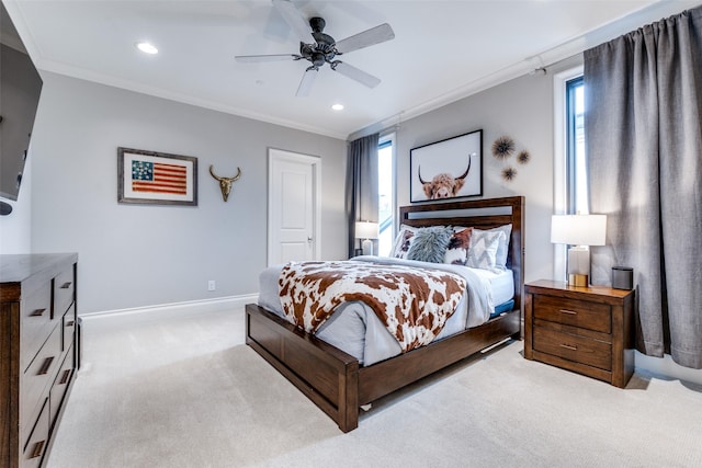 bedroom featuring ornamental molding, light carpet, and ceiling fan