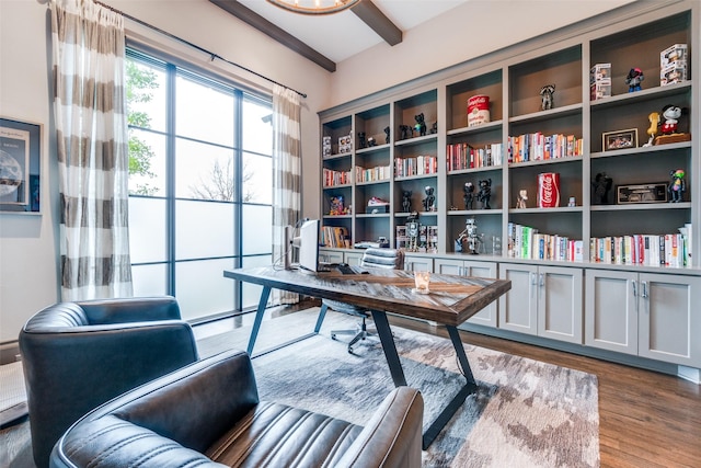 home office with beamed ceiling and hardwood / wood-style floors