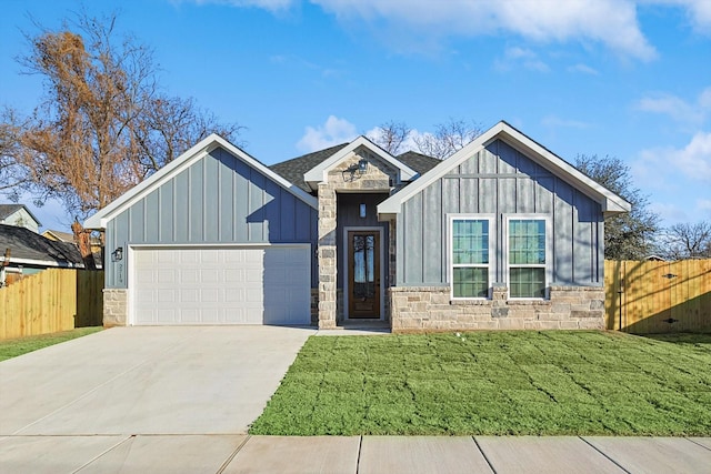 view of front of property featuring a garage and a front yard