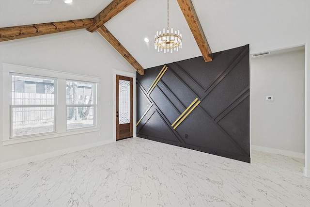 entrance foyer featuring vaulted ceiling with beams and an inviting chandelier