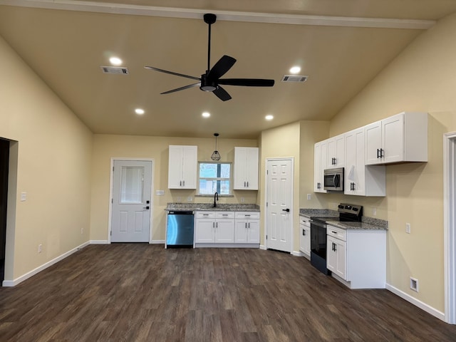 kitchen featuring dark hardwood / wood-style flooring, stainless steel appliances, white cabinets, and stone counters