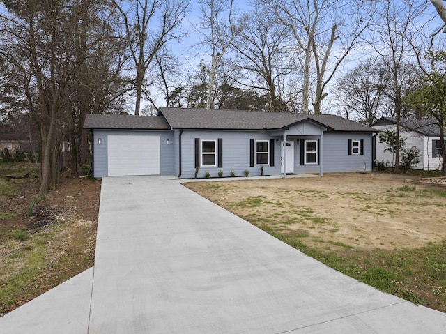 ranch-style home with a garage, concrete driveway, and roof with shingles