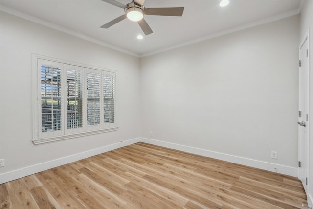 empty room featuring baseboards, a ceiling fan, crown molding, and light wood finished floors