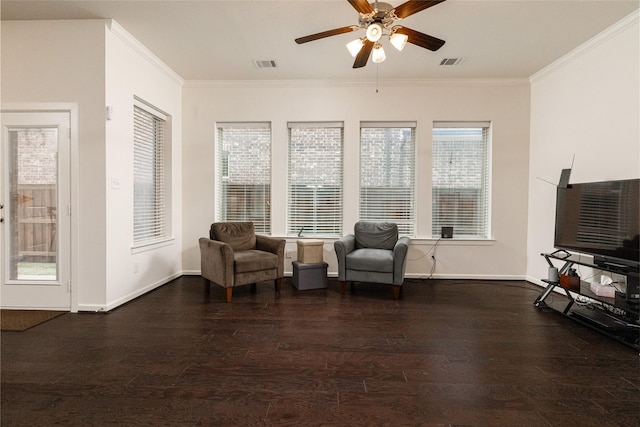 sitting room with ornamental molding, dark hardwood / wood-style floors, and ceiling fan