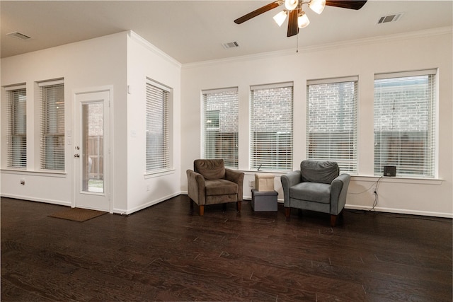 sitting room with ornamental molding, a healthy amount of sunlight, ceiling fan, and dark hardwood / wood-style flooring