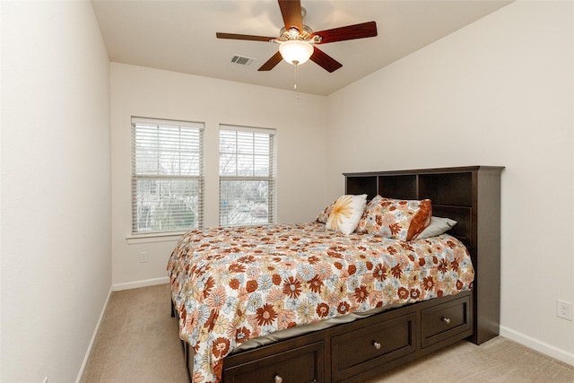 bedroom featuring light colored carpet and ceiling fan