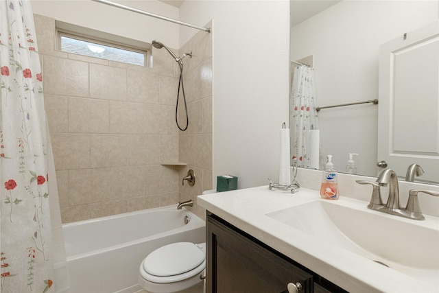 full bathroom featuring shower / tub combo with curtain, vanity, and toilet