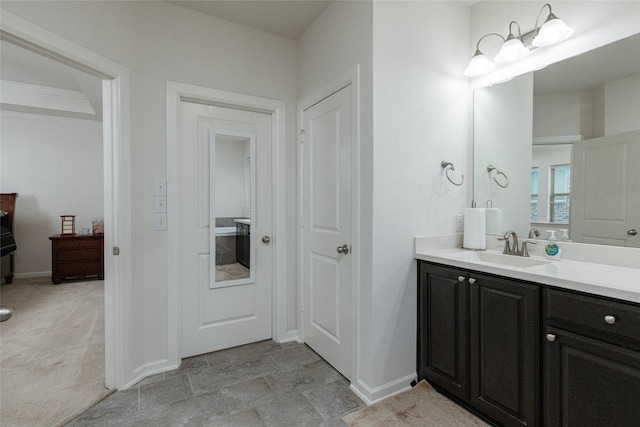 bathroom with vanity and crown molding