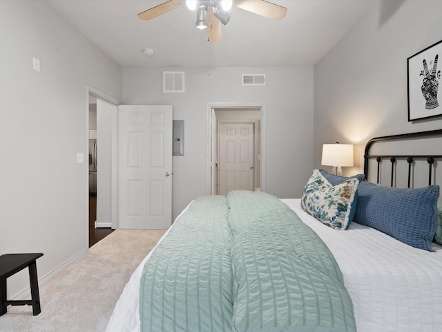 bedroom with electric panel, ceiling fan, and carpet flooring