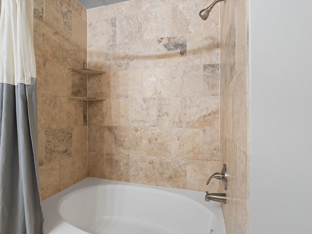 bathroom with shower / tub combo with curtain