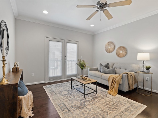 living room with crown molding, dark hardwood / wood-style floors, ceiling fan, and french doors