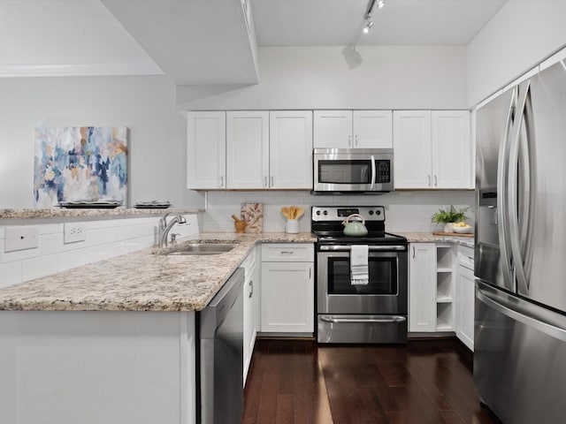 kitchen featuring sink, stainless steel appliances, and white cabinets