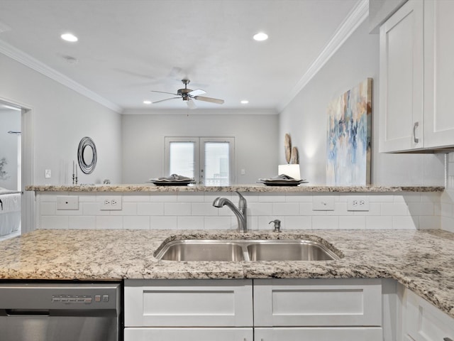 kitchen featuring sink, crown molding, dishwasher, white cabinetry, and decorative backsplash