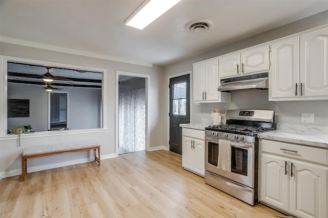 kitchen featuring white cabinetry, light hardwood / wood-style flooring, ceiling fan, and stainless steel gas stove