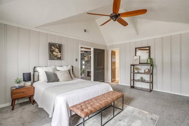 carpeted bedroom featuring ceiling fan and lofted ceiling