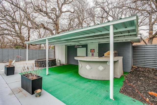 view of patio featuring exterior bar