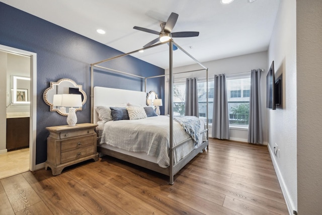 bedroom featuring hardwood / wood-style floors and ceiling fan