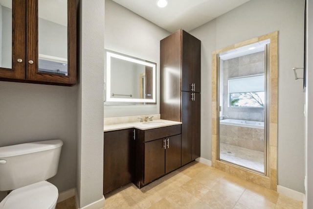 full bathroom with vanity, toilet, and separate shower and tub