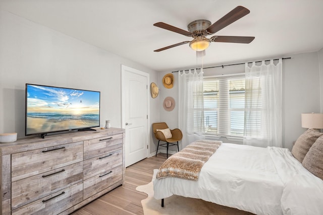 bedroom featuring ceiling fan and light hardwood / wood-style floors