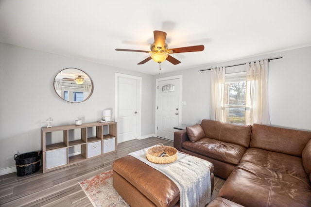 living room with wood-type flooring and ceiling fan