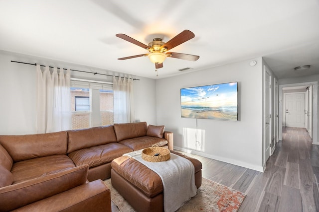 living room with hardwood / wood-style floors and ceiling fan