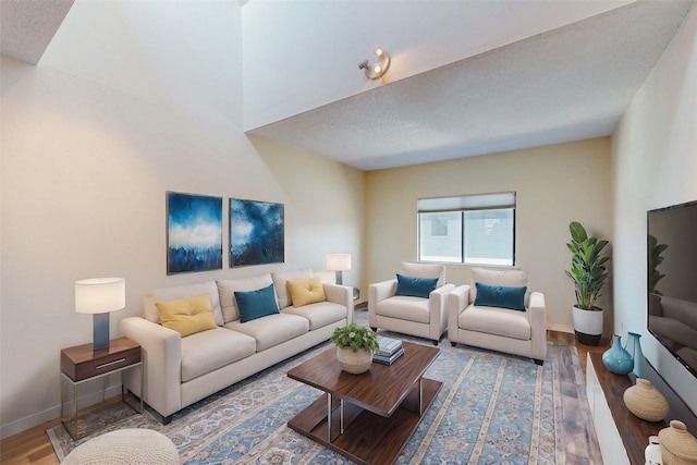 living area featuring wood finished floors and baseboards