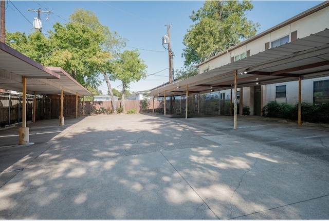 covered parking lot with fence