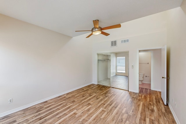 unfurnished bedroom featuring light wood-style flooring, baseboards, and visible vents