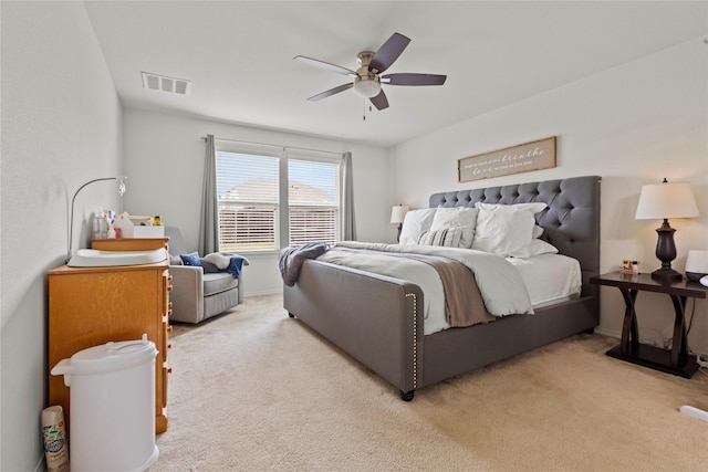 bedroom with light colored carpet and ceiling fan