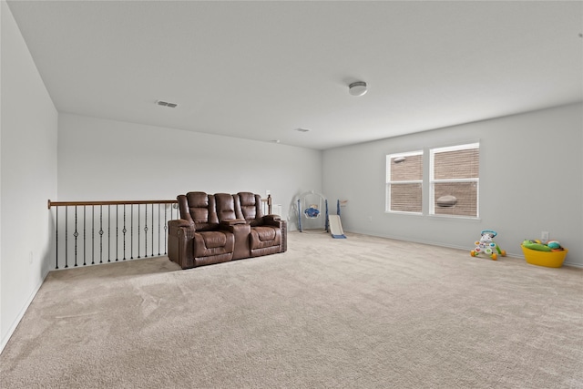 living area featuring light colored carpet