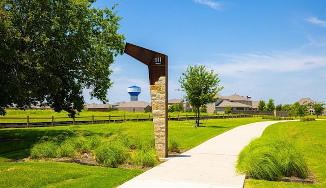 view of home's community featuring a yard