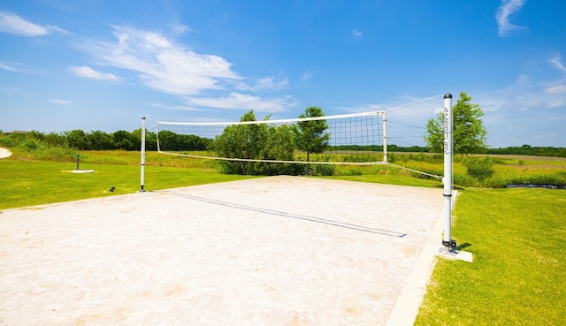 view of community with a yard and volleyball court