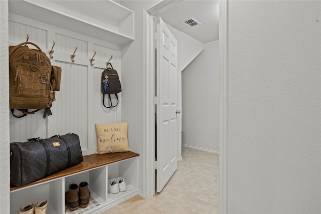 mudroom with light tile patterned flooring