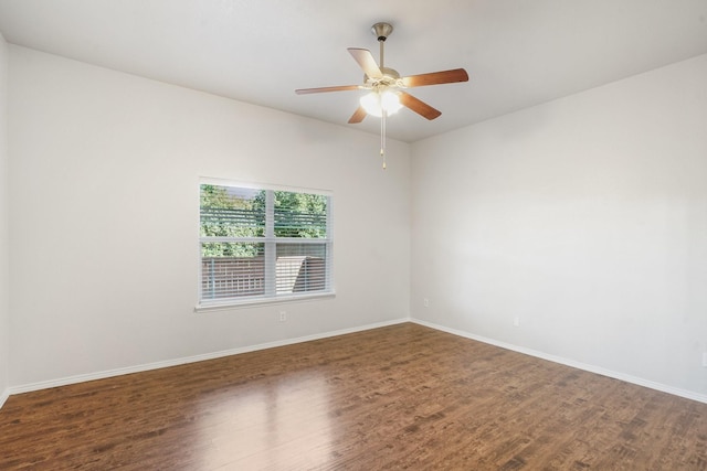 unfurnished room with dark hardwood / wood-style flooring and ceiling fan