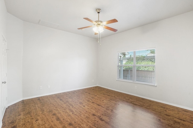 empty room with ceiling fan and hardwood / wood-style floors