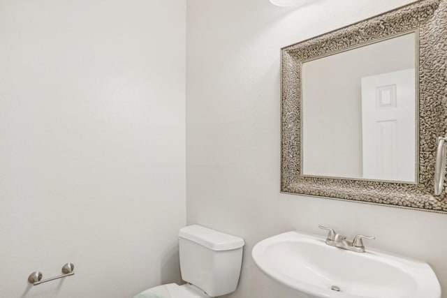 bathroom with sink and toilet