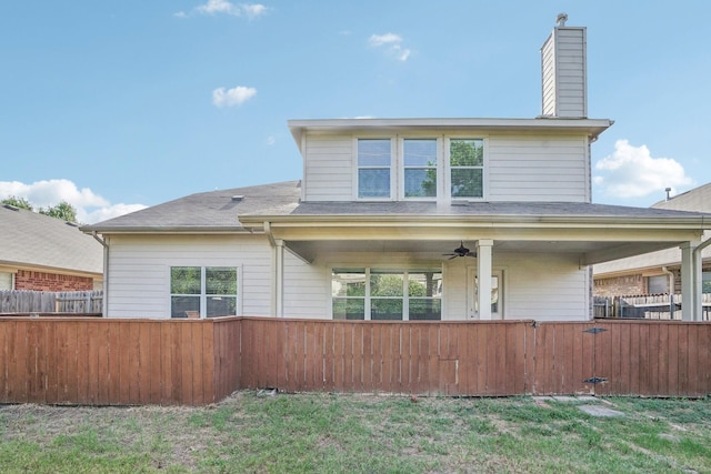 rear view of property with ceiling fan