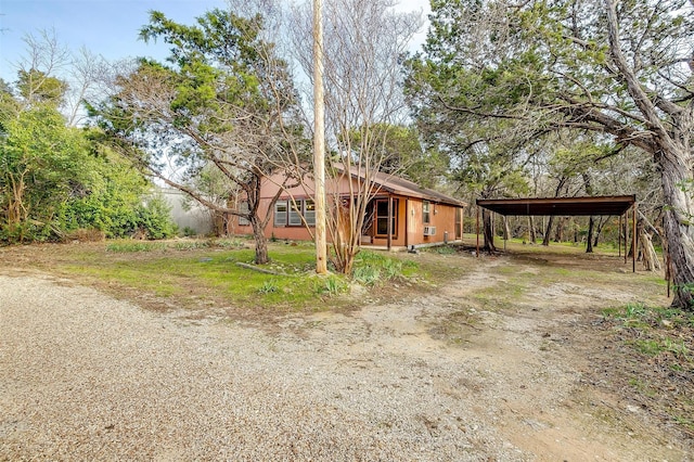 exterior space with a carport