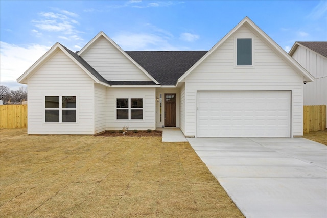 ranch-style home with a garage and a front yard