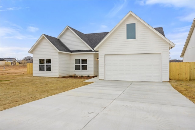 ranch-style house featuring a garage and a front lawn