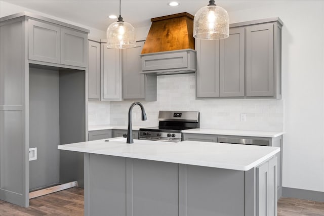 kitchen with pendant lighting, gray cabinets, and stainless steel electric range