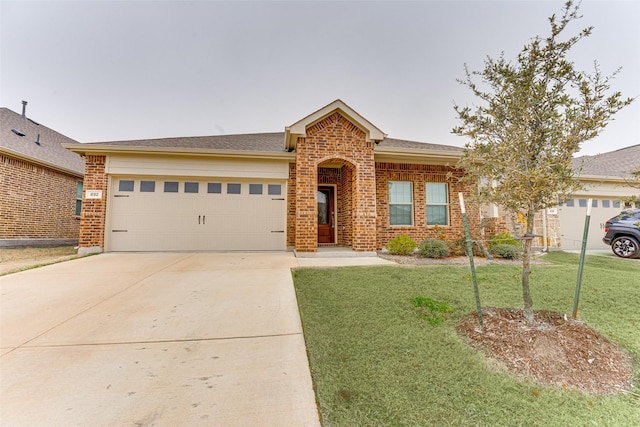 single story home with a garage and a front lawn