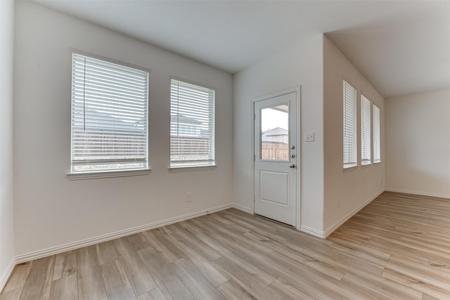 foyer entrance with light wood-type flooring