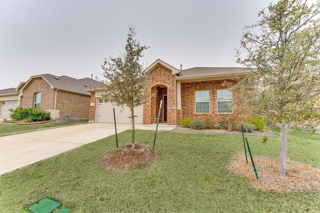 single story home featuring a garage and a front lawn