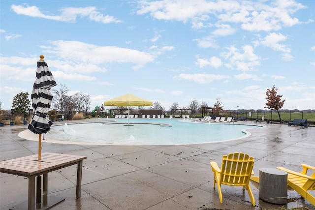 view of swimming pool featuring a patio area and pool water feature