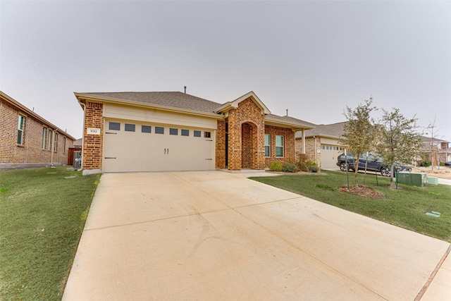 view of front of property with a front lawn and a garage