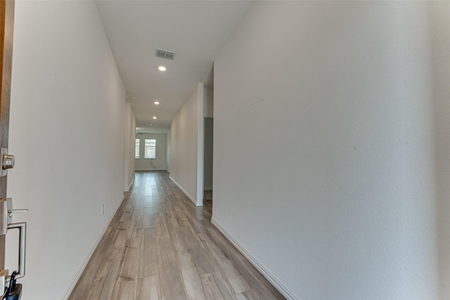 hallway with light wood-type flooring